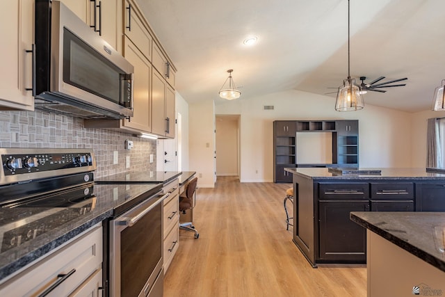 12500 E Del Rico, Yuma, AZ 85367 - kitchen with lofted ceiling, light wood-style floors, ceiling fan, tasteful backsplash, and stainless steel appliances