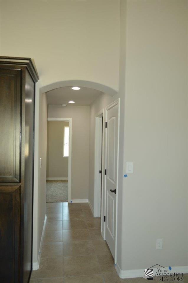 13132 E 55th Ln, Yuma, AZ 85367 - hallway with arched walkways and light tile patterned floors