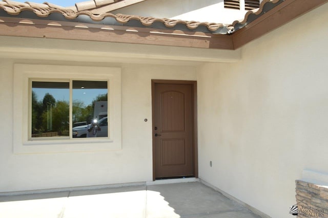 13132 E 55th Ln, Yuma, AZ 85367 - doorway to property featuring stucco siding