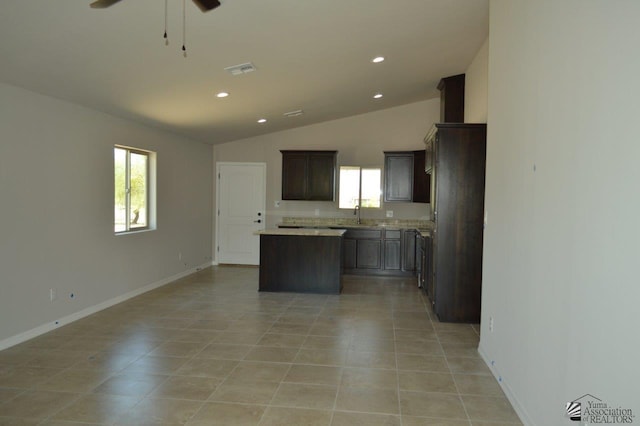 13132 E 55th Ln, Yuma, AZ 85367 - kitchen featuring a center island, lofted ceiling, ceiling fan, light tile patterned floors, and recessed lighting