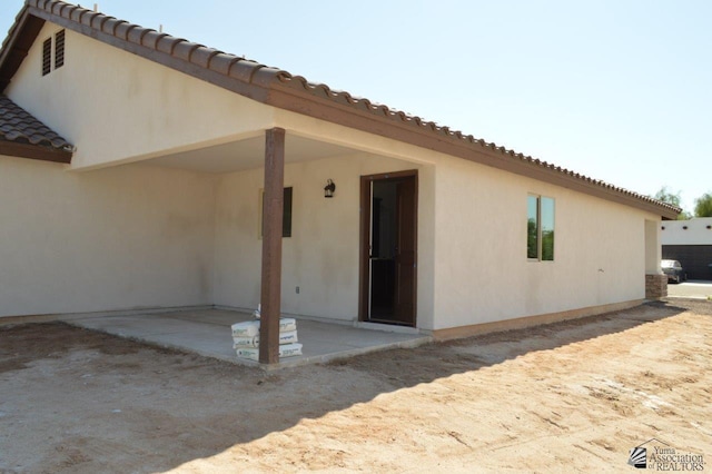 13132 E 55th Ln, Yuma, AZ 85367 - back of house featuring a tiled roof, a patio, and stucco siding