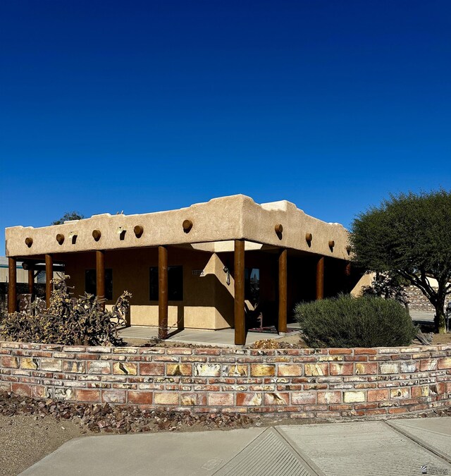 12696 E 45th Ln, Yuma, AZ 85367 - pueblo-style house with a patio area and stucco siding
