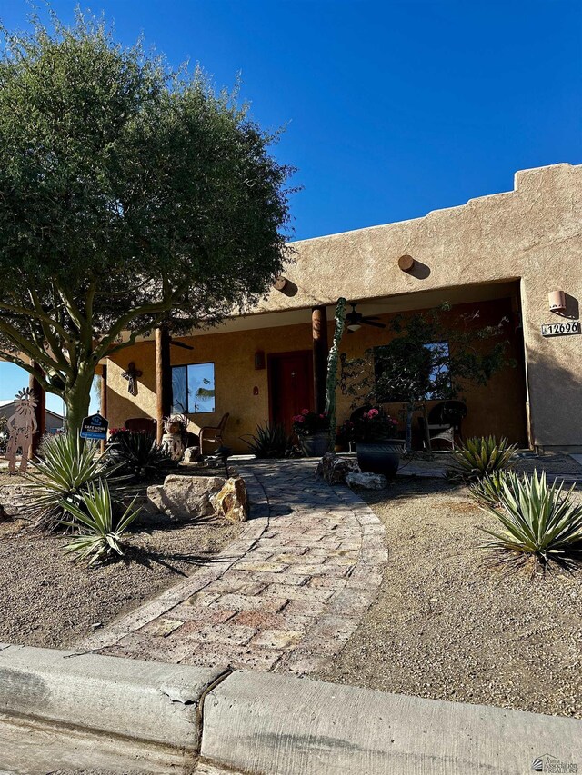 12696 E 45th Ln, Yuma, AZ 85367 - pueblo revival-style home with a patio and ceiling fan