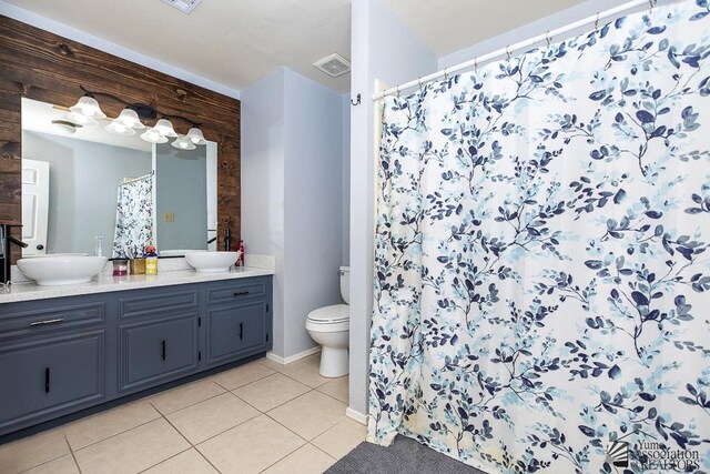543 E 25th St, Yuma, AZ 85365 - bathroom with tile patterned flooring, double vanity, and a shower with curtain