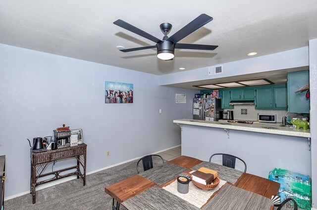 543 E 25th St, Yuma, AZ 85365 - dining room with a ceiling fan and light colored carpet