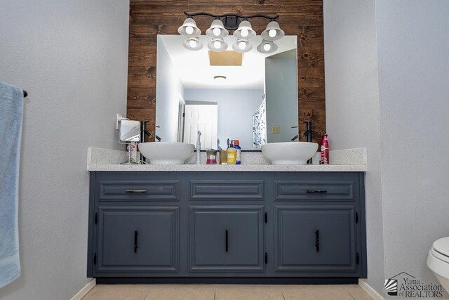 543 E 25th St, Yuma, AZ 85365 - full bathroom featuring double vanity and tile patterned flooring