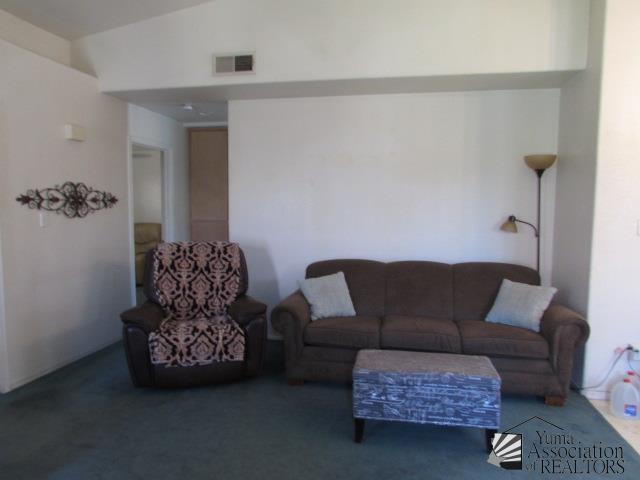10646 S Via Salida, Yuma, AZ 85367 - carpeted living area with vaulted ceiling