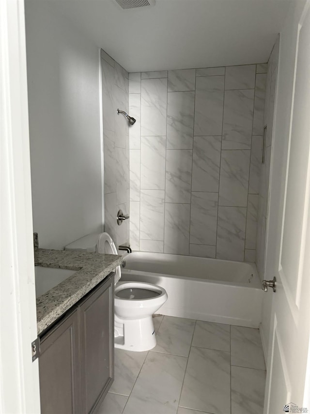 10857 E 45th Pl, Yuma, AZ 85367 - full bathroom featuring vanity, marble look tiles, and bathing tub / shower combination