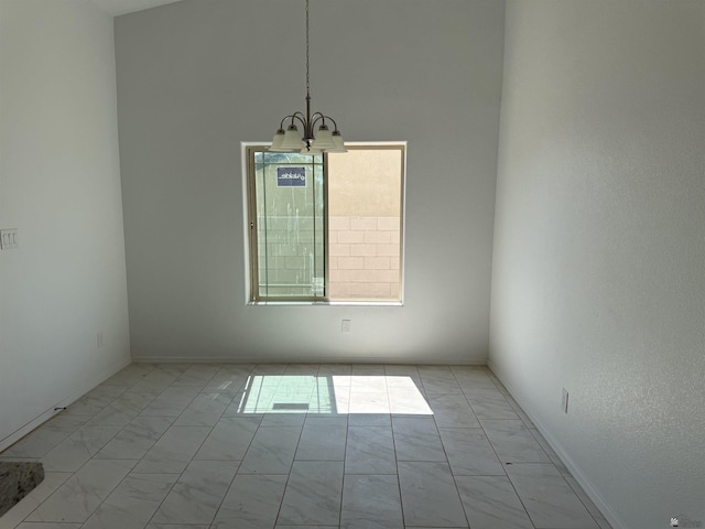 10857 E 45th Pl, Yuma, AZ 85367 - empty room with light marble finish floors and a chandelier