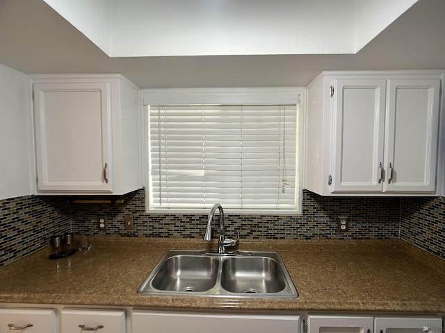 1700 S Crowder Ave, Yuma, AZ 85364 - kitchen featuring white cabinets, decorative backsplash, and dark countertops