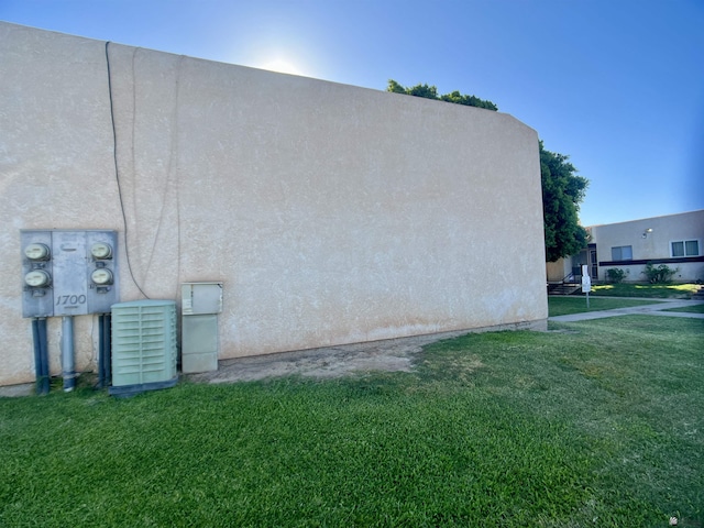 1700 S Crowder Ave, Yuma, AZ 85364 - view of home's exterior featuring a lawn and stucco siding