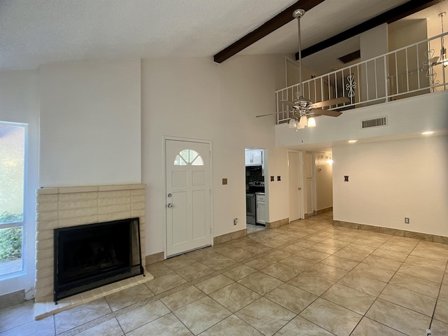 1700 S Crowder Ave, Yuma, AZ 85364 - entryway featuring ceiling fan, high vaulted ceiling, a brick fireplace, light tile patterned floors, and beam ceiling