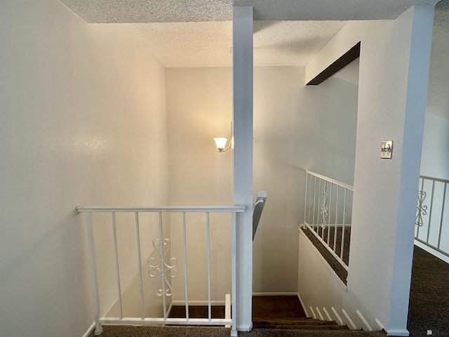 1700 S Crowder Ave, Yuma, AZ 85364 - staircase with a textured ceiling and carpet