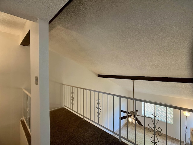 1700 S Crowder Ave, Yuma, AZ 85364 - hallway featuring a textured ceiling, beamed ceiling, and carpet