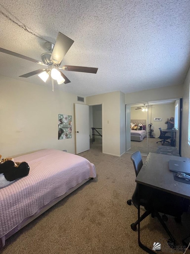1233 W 20th Pl, Yuma, AZ 85364 - bedroom with carpet flooring, a textured ceiling, visible vents, and a closet