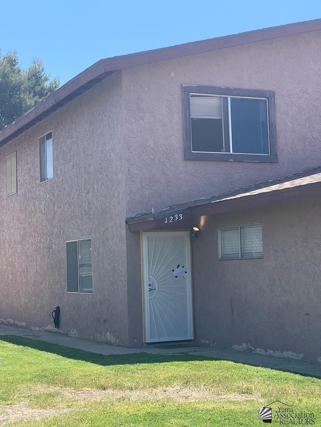 1233 W 20th Pl, Yuma, AZ 85364 - view of front facade featuring stucco siding