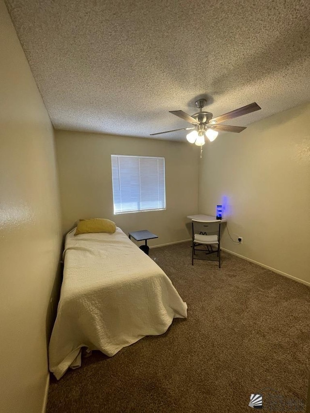 1233 W 20th Pl, Yuma, AZ 85364 - carpeted bedroom with baseboards, a ceiling fan, and a textured ceiling