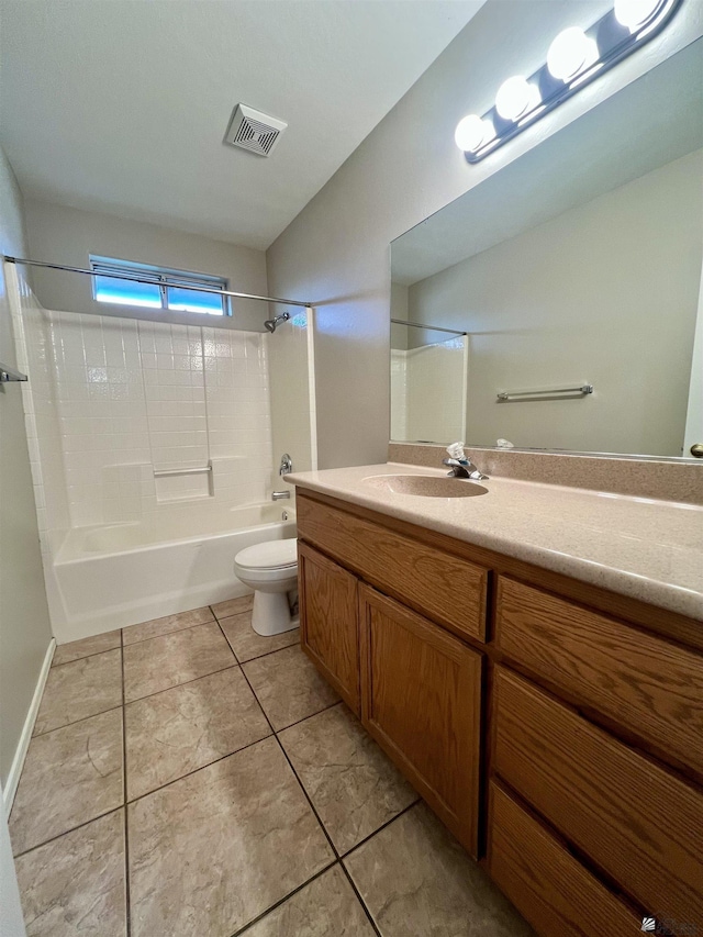 full bathroom with shower / bath combination, vanity, tile patterned flooring, and toilet