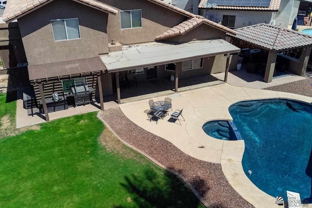 back of house with a patio area