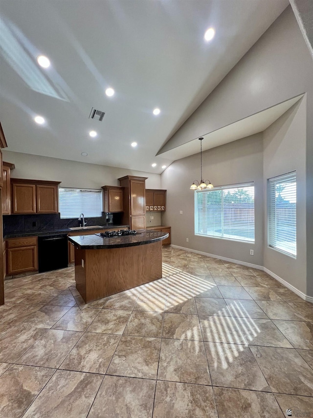 kitchen with sink, dishwasher, hanging light fixtures, a center island, and a notable chandelier