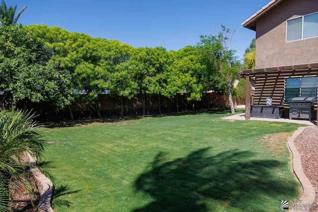 view of yard with a pergola and a patio area