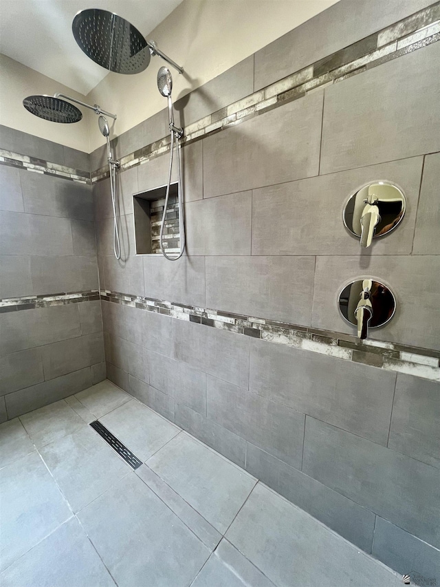 bathroom with tiled shower