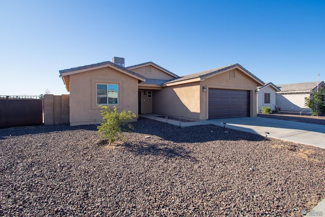 11681 E 33rd St, Yuma, AZ 85367 - single story home with a garage, fence, stucco siding, and concrete driveway