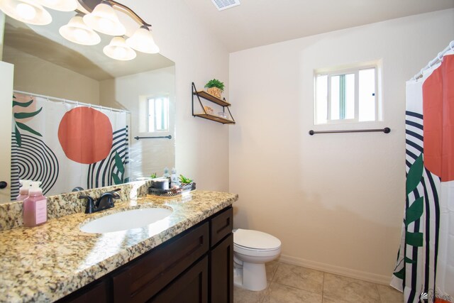 11681 E 33rd St, Yuma, AZ 85367 - full bath with toilet, vanity, tile patterned floors, and baseboards