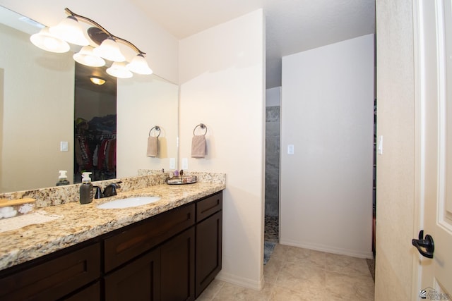 11681 E 33rd St, Yuma, AZ 85367 - full bath featuring vanity, a spacious closet, and tile patterned floors