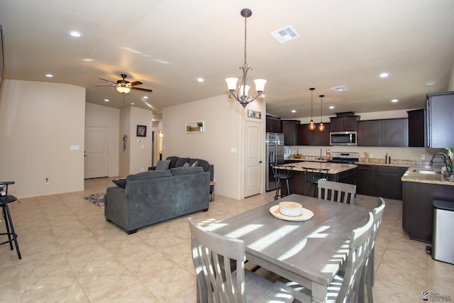 11681 E 33rd St, Yuma, AZ 85367 - dining space with recessed lighting, a ceiling fan, and a chandelier