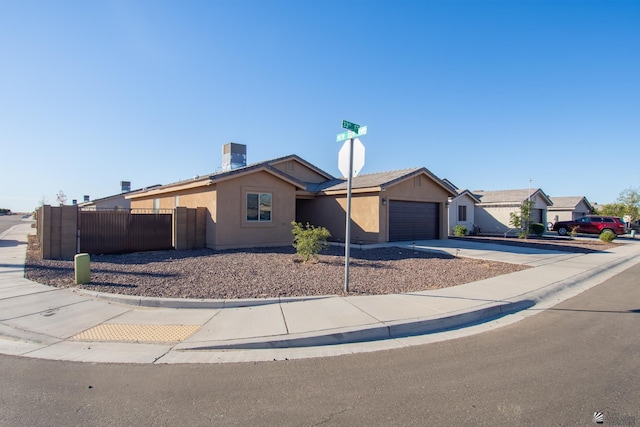 11681 E 33rd St, Yuma, AZ 85367 - ranch-style house with stucco siding, fence, concrete driveway, and a garage