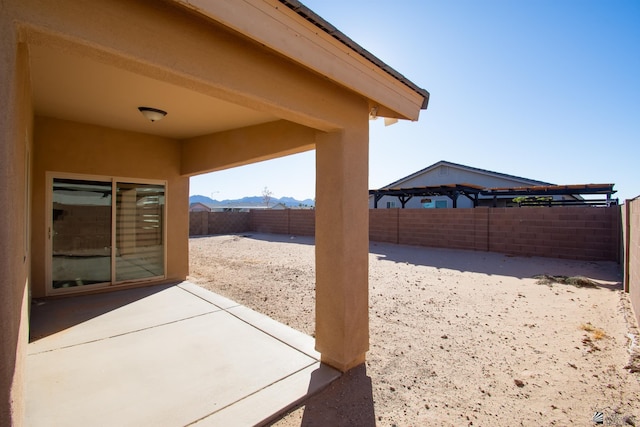 11681 E 33rd St, Yuma, AZ 85367 - view of patio with a fenced backyard and a mountain view
