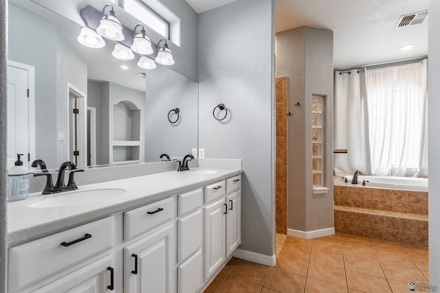 12170 E 33rd Pl, Yuma, AZ 85367 - full bath featuring tile patterned floors, double vanity, a bath, tiled shower, and baseboards