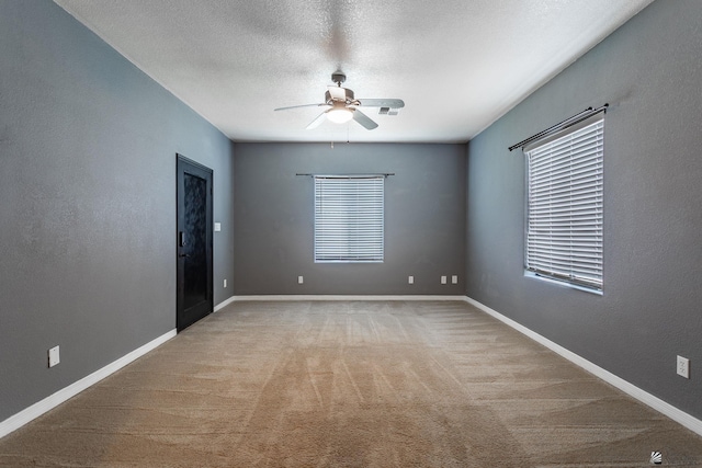 12170 E 33rd Pl, Yuma, AZ 85367 - spare room with a ceiling fan, plenty of natural light, light carpet, and baseboards