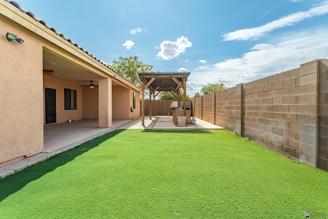 12170 E 33rd Pl, Yuma, AZ 85367 - fenced backyard featuring a ceiling fan, a patio area, and a pergola