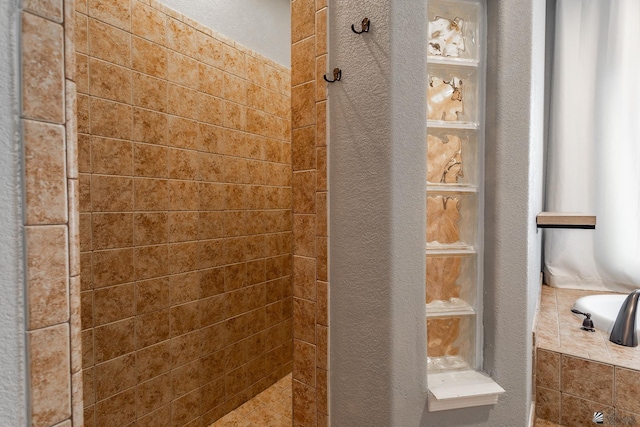 12170 E 33rd Pl, Yuma, AZ 85367 - full bathroom featuring a tile shower and a textured wall