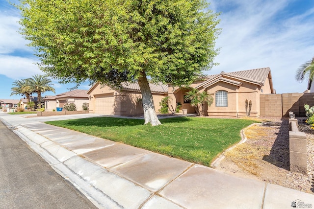 12170 E 33rd Pl, Yuma, AZ 85367 - view of front of house with stucco siding, a tile roof, concrete driveway, and a garage