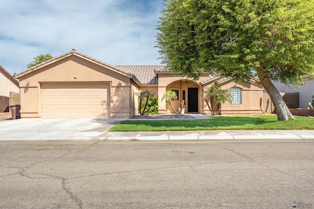 12170 E 33rd Pl, Yuma, AZ 85367 - view of front of house featuring stucco siding, a tiled roof, concrete driveway, and an attached garage
