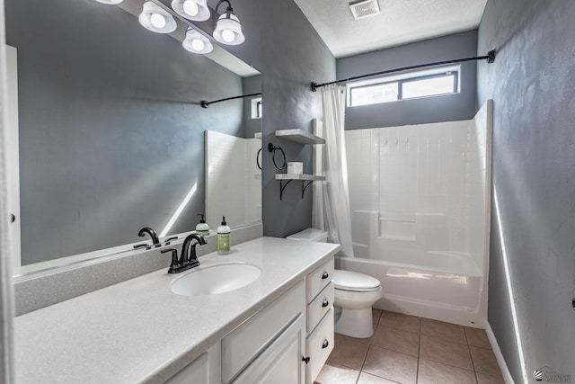 12170 E 33rd Pl, Yuma, AZ 85367 - bathroom featuring shower / bath combo with shower curtain, tile patterned flooring, toilet, vanity, and a textured ceiling