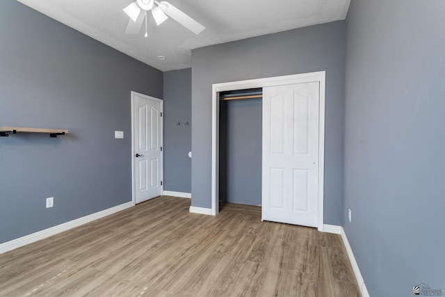12170 E 33rd Pl, Yuma, AZ 85367 - unfurnished bedroom with wood finished floors, baseboards, a closet, and ceiling fan