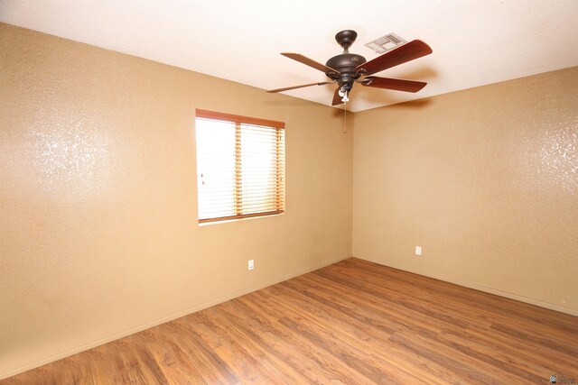 3023 W 26th St, Yuma, AZ 85364 - empty room with a ceiling fan, wood finished floors, and a textured ceiling
