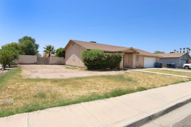 3023 W 26th St, Yuma, AZ 85364 - view of front facade with a garage, concrete driveway, and stucco siding