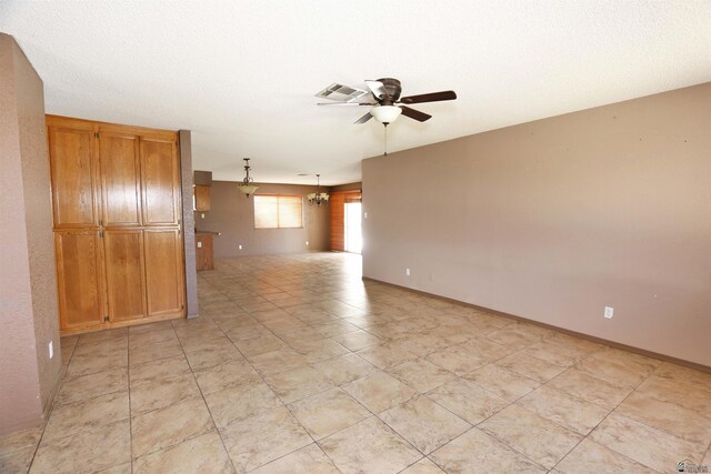 3023 W 26th St, Yuma, AZ 85364 - kitchen featuring white fridge with ice dispenser, a peninsula, a chandelier, dark countertops, and under cabinet range hood