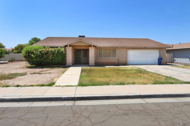 3023 W 26th St, Yuma, AZ 85364 - ranch-style home with a garage, concrete driveway, and stucco siding