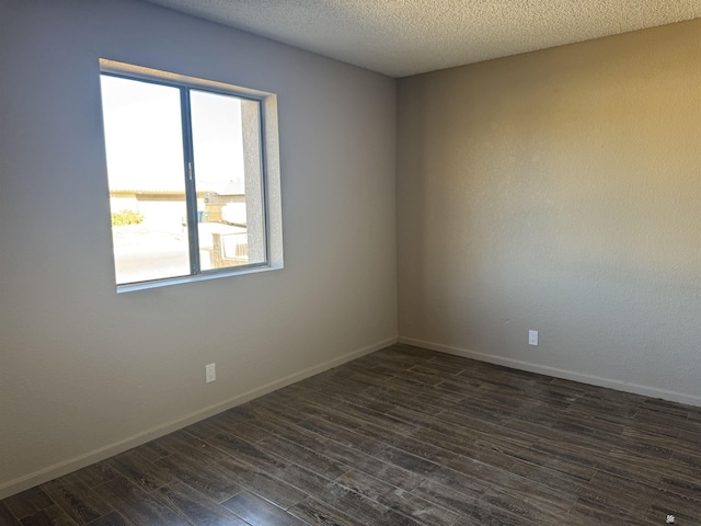 1276 S Pagent Ave, Yuma, AZ 85364 - unfurnished room with dark wood finished floors and a textured ceiling