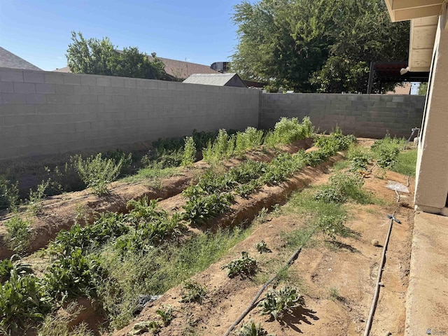 1276 S Pagent Ave, Yuma, AZ 85364 - fenced backyard featuring a garden