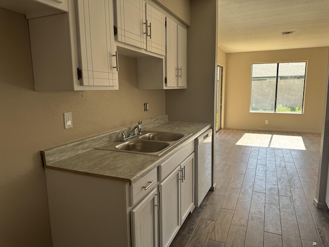 1276 S Pagent Ave, Yuma, AZ 85364 - kitchen featuring dishwasher, dark wood-style floors, open floor plan, and light countertops