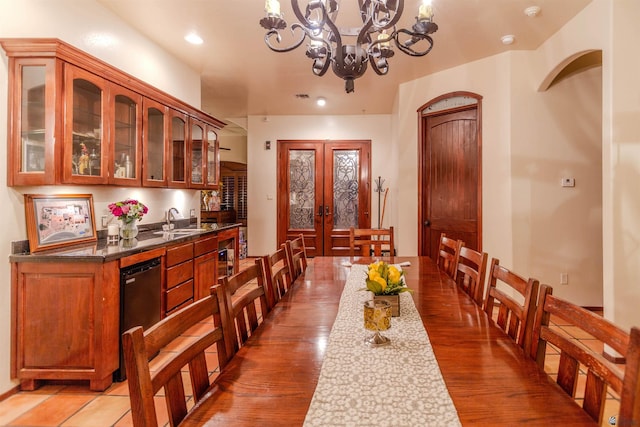 dining room featuring an inviting chandelier, light wood-style floors, french doors, and recessed lighting