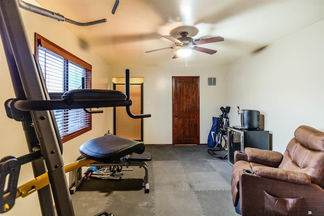 exercise room with baseboards, a ceiling fan, and visible vents
