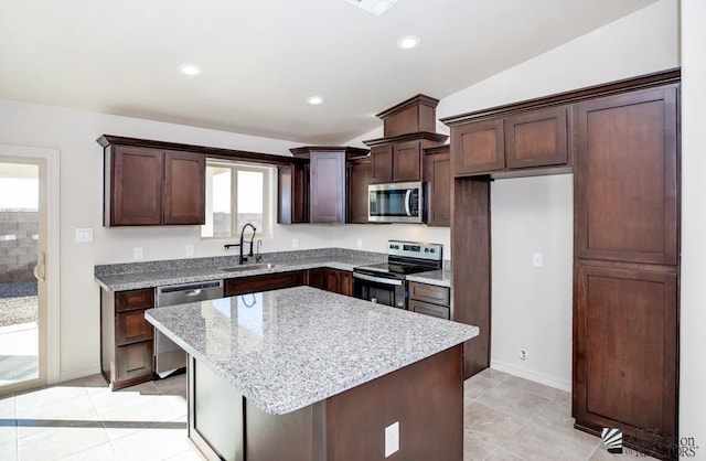 12546 E 51st Pl, Yuma, AZ 85367 - kitchen with a sink, appliances with stainless steel finishes, dark brown cabinetry, and light tile patterned flooring